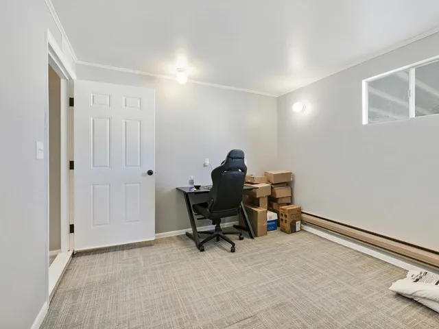 a view of a yard in front of a house with large trees