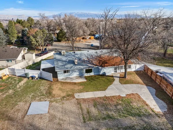 a view of a house with a back yard