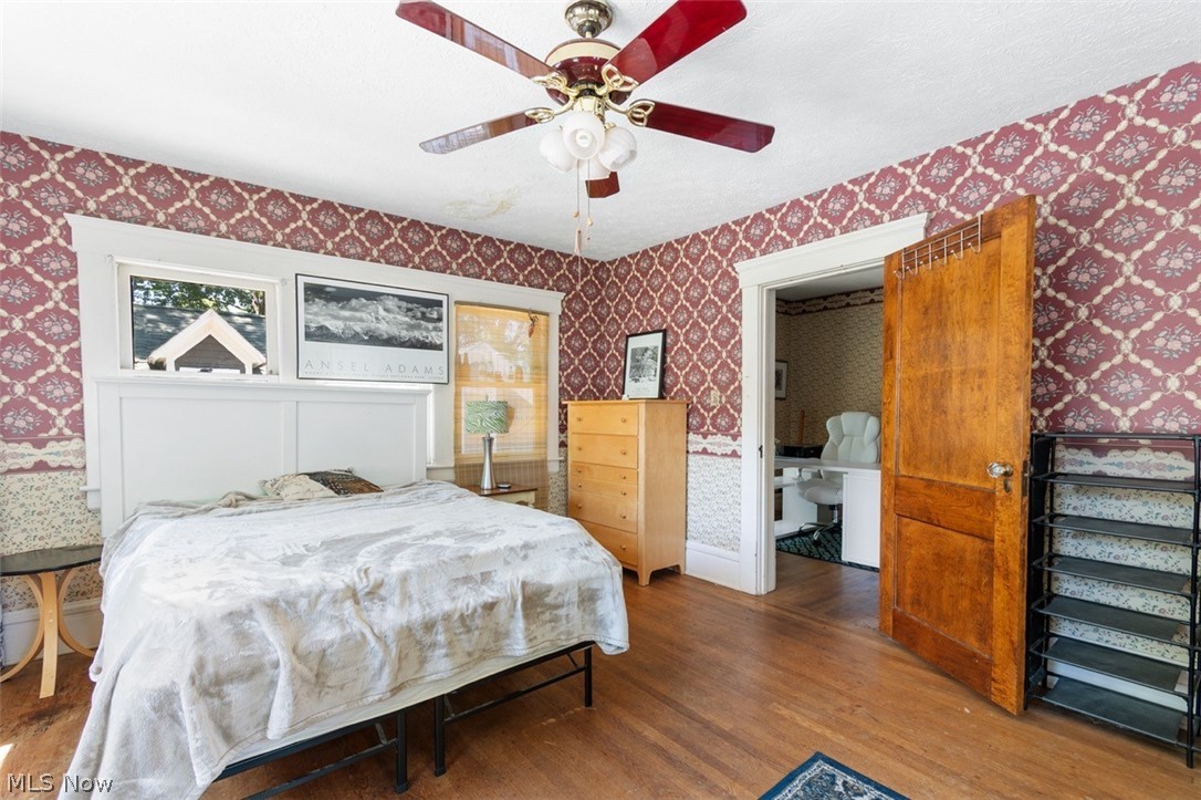 296 Merriman Road Akron, OH 44303 - Photo 22 of 33 Bedroom with hardwood / wood-style flooring, ensuite bathroom, and ceiling fan