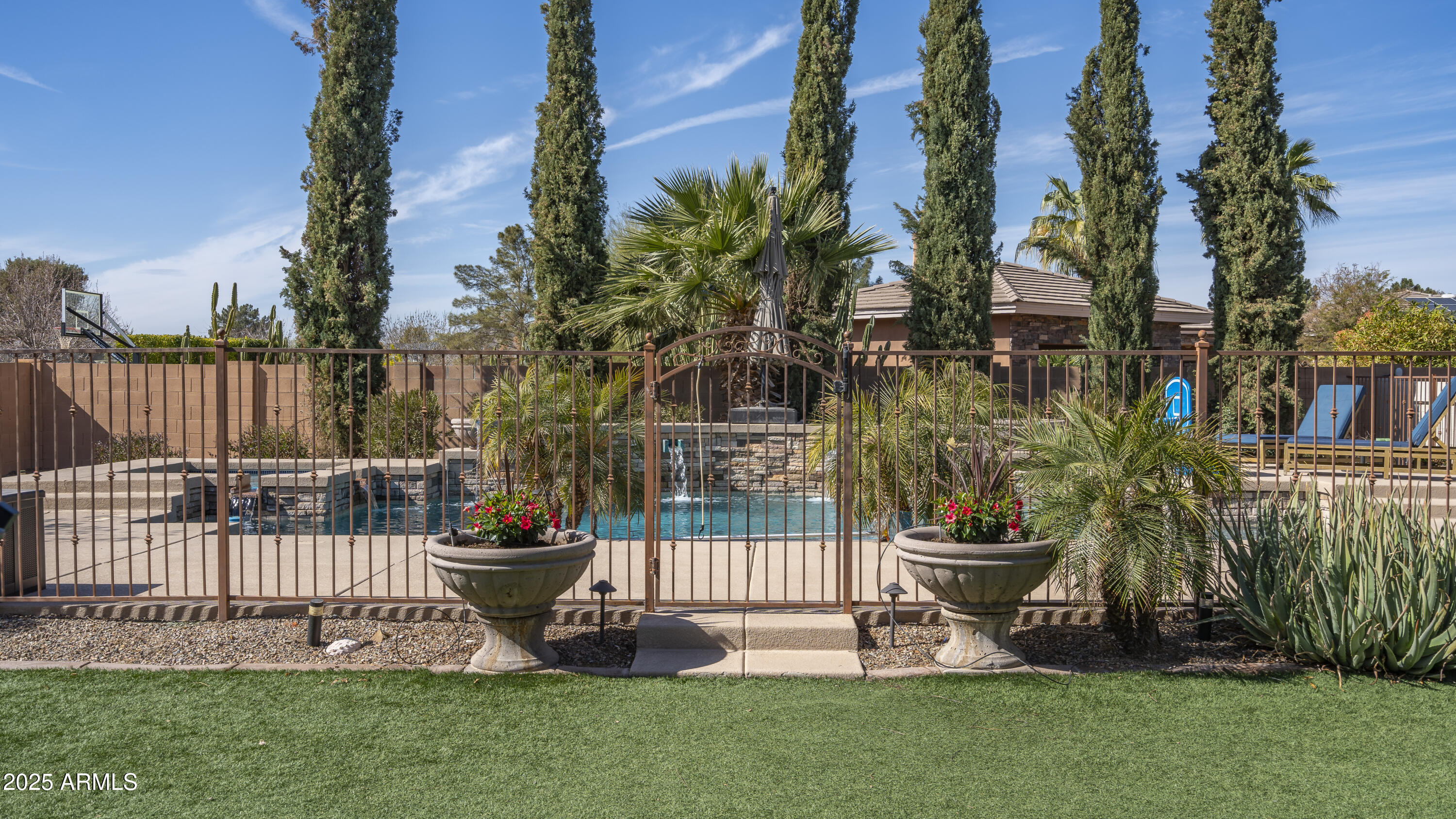 56 South Prairie Road Gilbert, AZ 85296 - Photo 40 of 59 a garden with trees in the background
