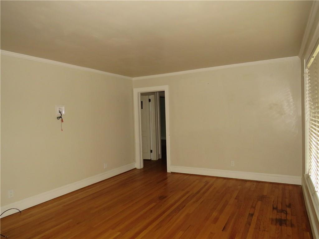 228 Marshall Street Cedartown, GA 30125 - Photo 11 of 22 a view of an empty room with wooden floor