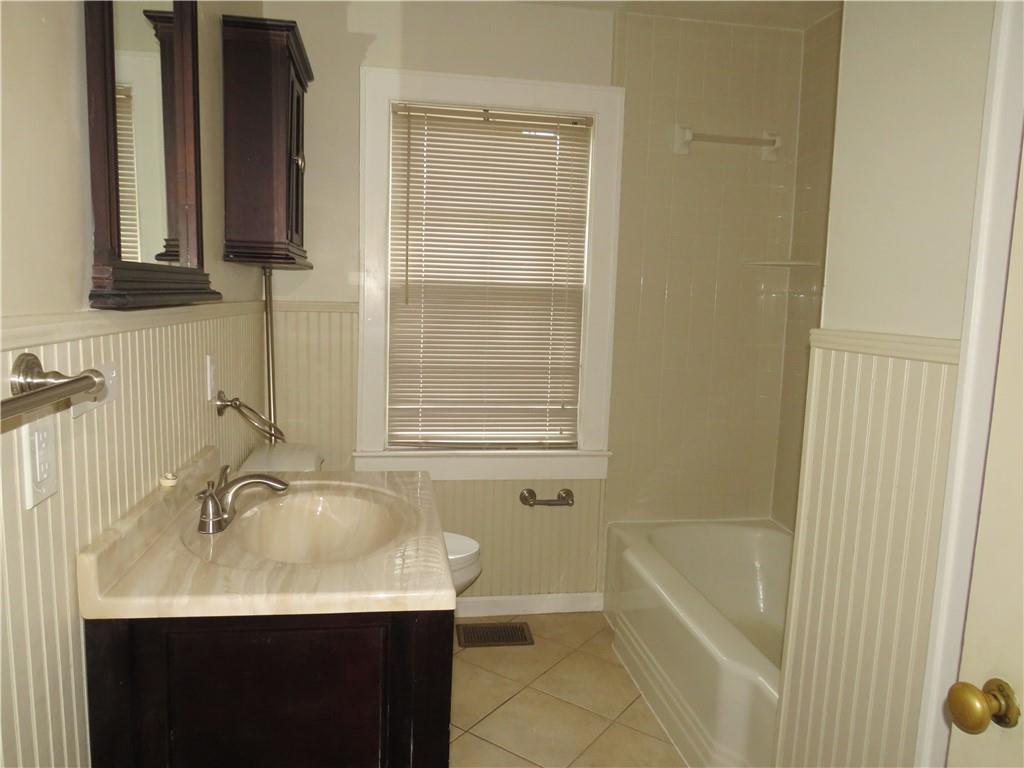 228 Marshall Street Cedartown, GA 30125 - Photo 12 of 22 a bathroom with a sink and a bathtub