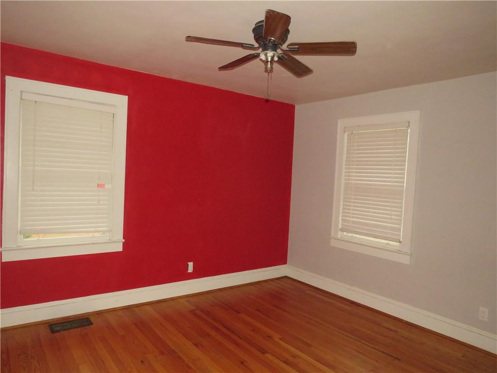 228 Marshall Street Cedartown, GA 30125 - Photo 13 of 22 a view of an empty room with window and wooden floor