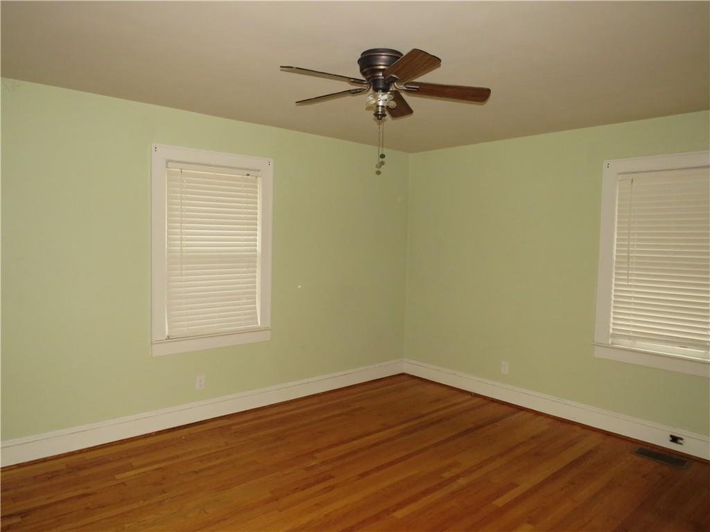 228 Marshall Street Cedartown, GA 30125 - Photo 14 of 22 a view of a room with a wooden floor and a window
