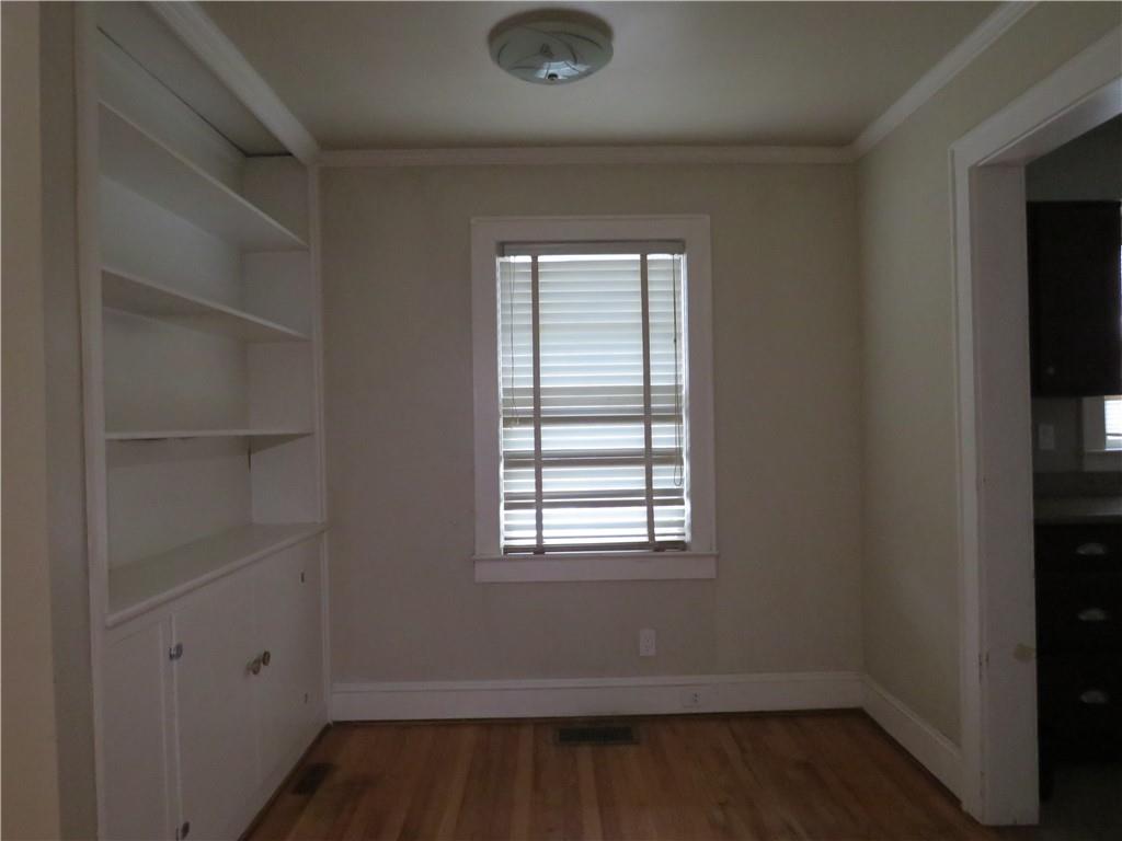 228 Marshall Street Cedartown, GA 30125 - Photo 16 of 22 a room that has a window and wooden floor