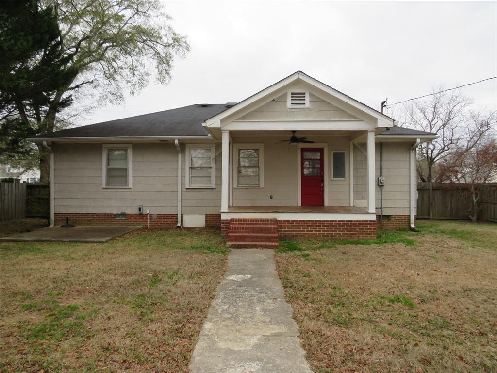 228 Marshall Street Cedartown, GA 30125 - Photo 4 of 22 a front view of a house with garden