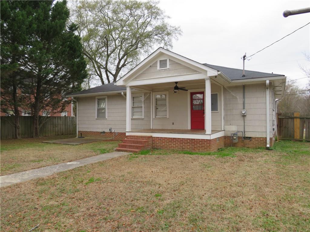 228 Marshall Street Cedartown, GA 30125 - Photo 5 of 22 a view of a house with a yard and large tree