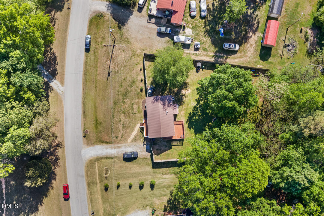 454 Cedar Creek Road Timberlake, NC 27583 - Photo 32 of 39 an aerial view of a house with swimming pool and garden