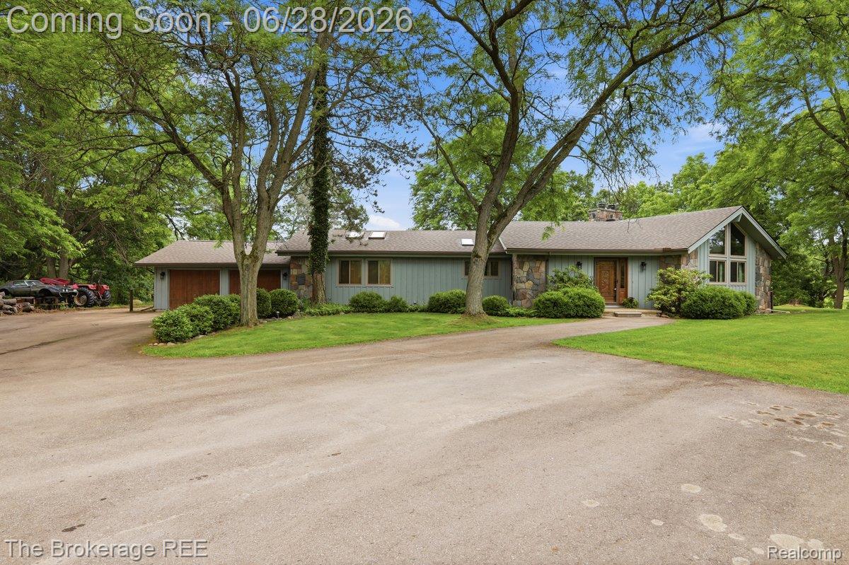 8475 Knox Road Clarkston, MI 48348 - Photo 1 of 71 Ranch-style residence featuring a prominent gable roofline and a stone facade accent