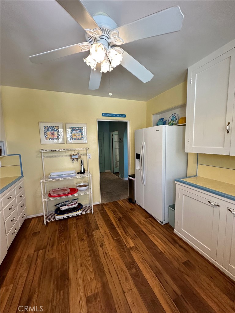 332 Encino Lane, Unit A San Clemente, CA 92672 - Photo 2 of 6 a bedroom with a bed and a chandelier