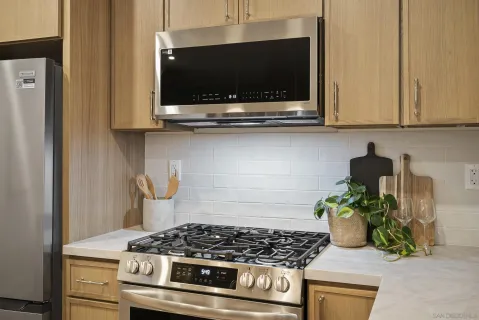 a kitchen with a stove and a microwave