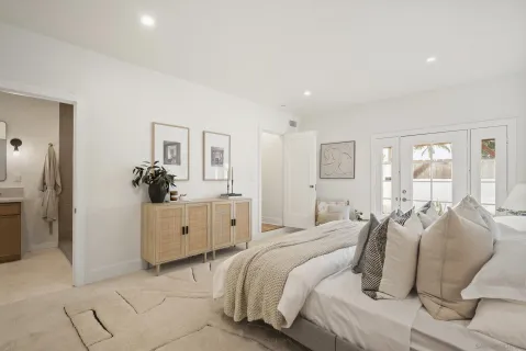 a bedroom with a bed and window