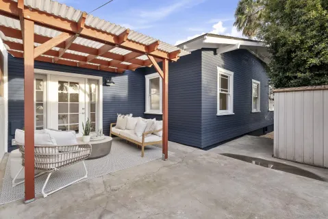 a balcony with furniture and a gate