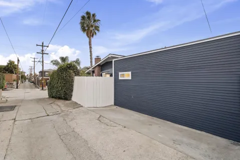 a view of a street with a garage
