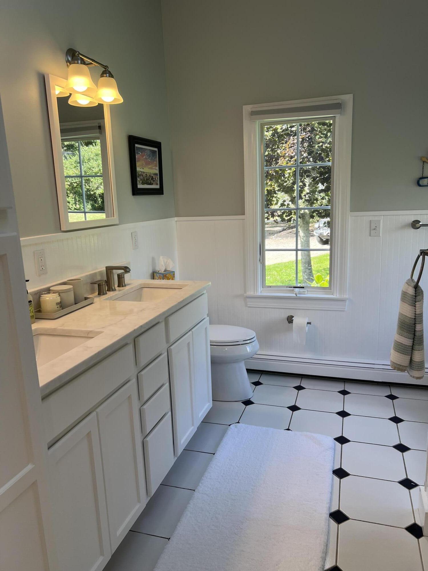 69 Joan Road Barnstable, MA 02632 - Photo 15 of 26 a bathroom with a sink and a mirror
