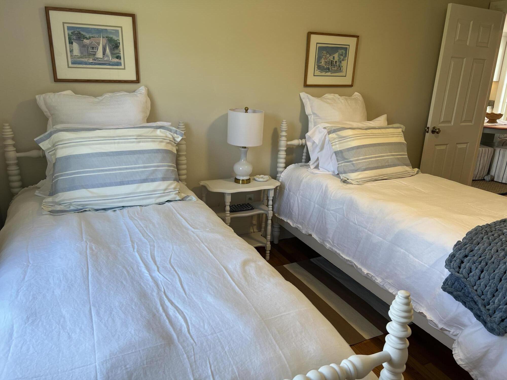 69 Joan Road Barnstable, MA 02632 - Photo 18 of 26 a bedroom with a bed and lamp