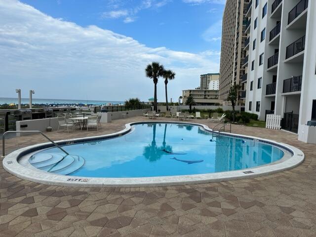 1044 Highway 98, Unit PH1403 Destin, FL 32541 - Photo 39 of 49 a view of a swimming pool with outdoor seating