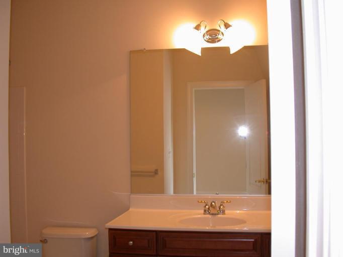 1730 Carpenter Road Alexandria, VA 22314 - Photo 11 of 20 a bathroom with a sink and a mirror