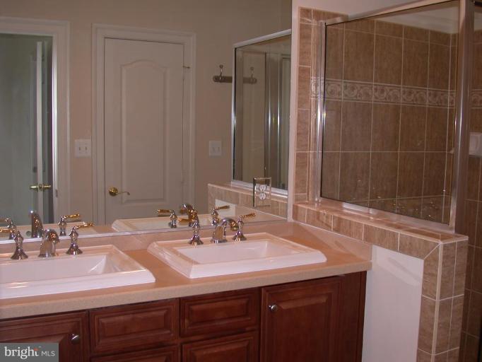 1730 Carpenter Road Alexandria, VA 22314 - Photo 6 of 20 a bathroom with a sink and a mirror