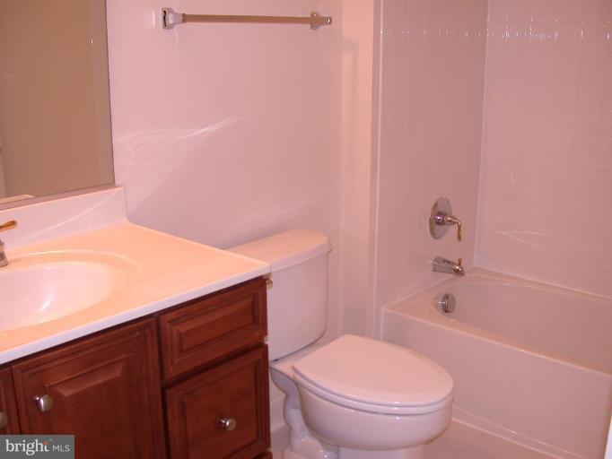 1730 Carpenter Road Alexandria, VA 22314 - Photo 7 of 20 a bathroom with a sink a toilet and shower