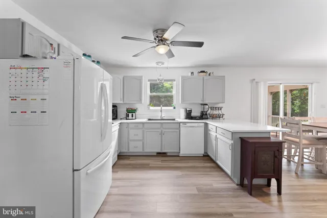a aerial view of a house with pool and a yard