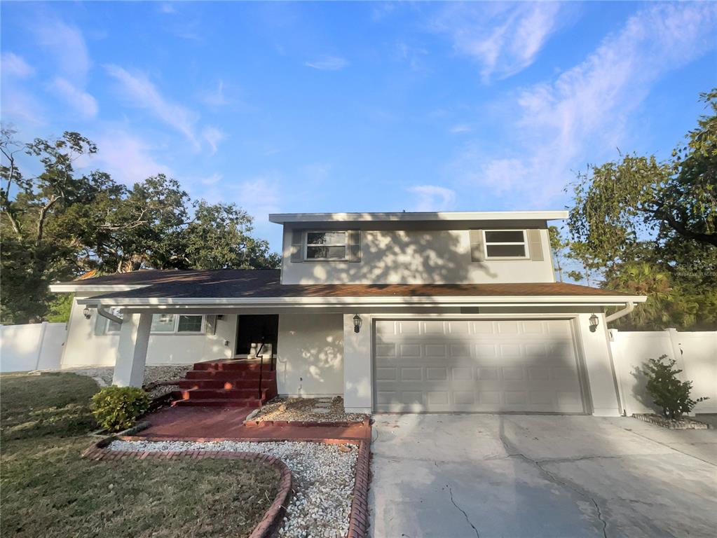 1911 Rambling Lane Brandon, FL 33510 - Photo 2 of 29 a view of a house with a yard