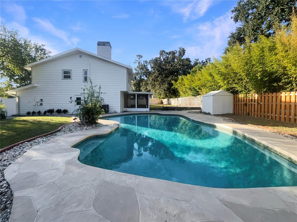 1911 Rambling Lane Brandon, FL 33510 - Photo 26 of 29 a view of a house with backyard and sitting area