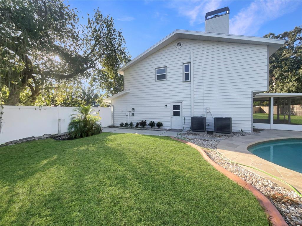 1911 Rambling Lane Brandon, FL 33510 - Photo 27 of 29 a view of a backyard with a garden