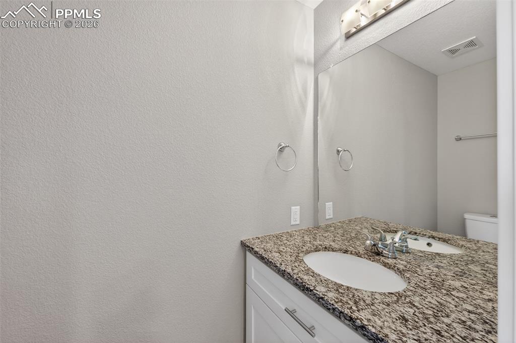 216 Ash Street Bennett, CO 80102 - Photo 15 of 46 Powder Bathroom