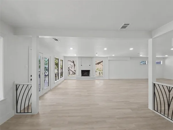 a view of a hallway with stairs