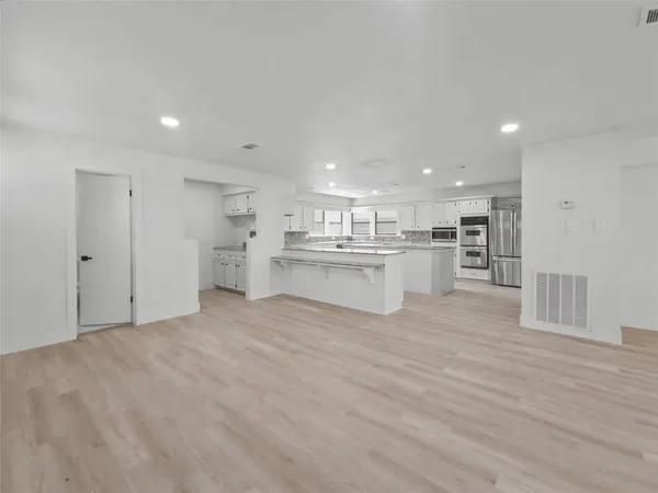 a view of kitchen with wooden floor