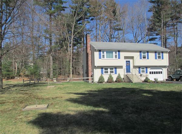 22 Rickey Drive Maynard, MA 01754 - Photo 1 of 16 a front view of a house with a garden