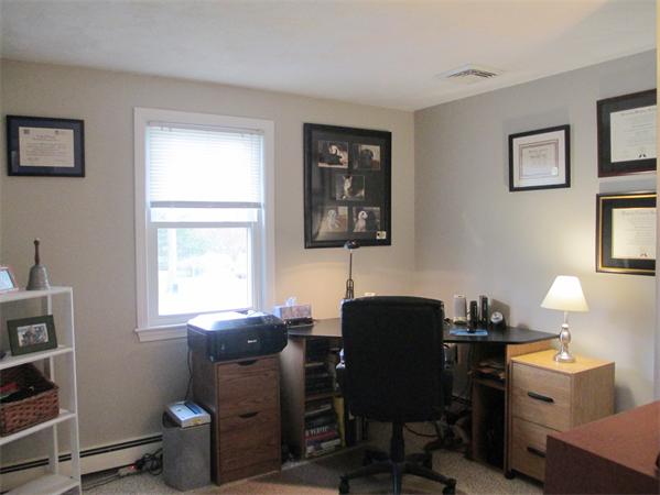 22 Rickey Drive Maynard, MA 01754 - Photo 11 of 16 a view of a workspace with furniture and a window