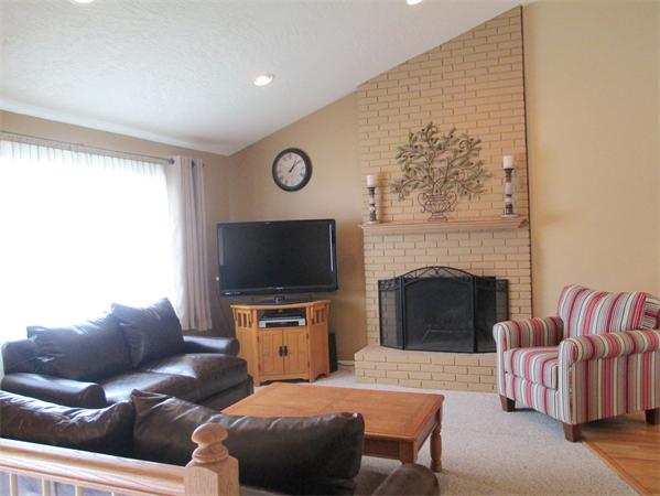 22 Rickey Drive Maynard, MA 01754 - Photo 3 of 16 a living room with furniture and a flat screen tv