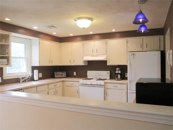 22 Rickey Drive Maynard, MA 01754 - Photo 6 of 16 a kitchen that has a cabinets and a stove