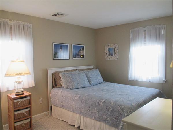 22 Rickey Drive Maynard, MA 01754 - Photo 9 of 16 a bedroom with a bed and a window