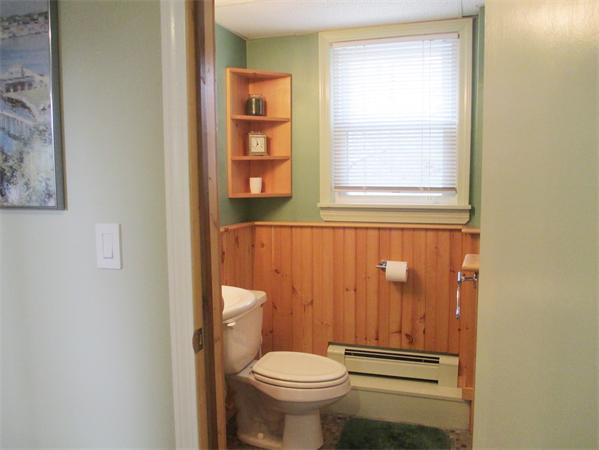 22 Rickey Drive Maynard, MA 01754 - Photo 10 of 16 a white toilet sitting next to a bathroom sink