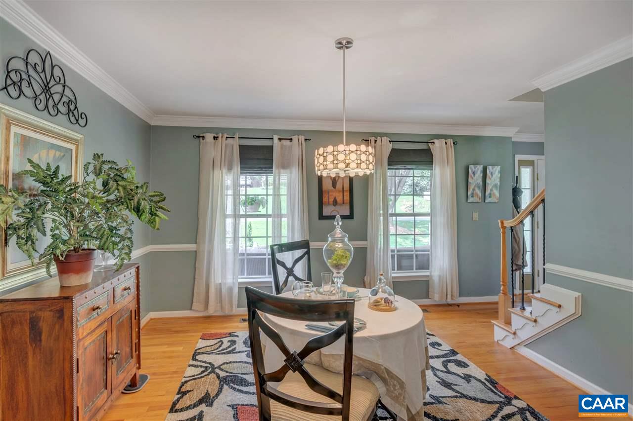 1209 Raintree Drive Charlottesville, VA 22901 - Photo 15 of 46 a living room with furniture and a table