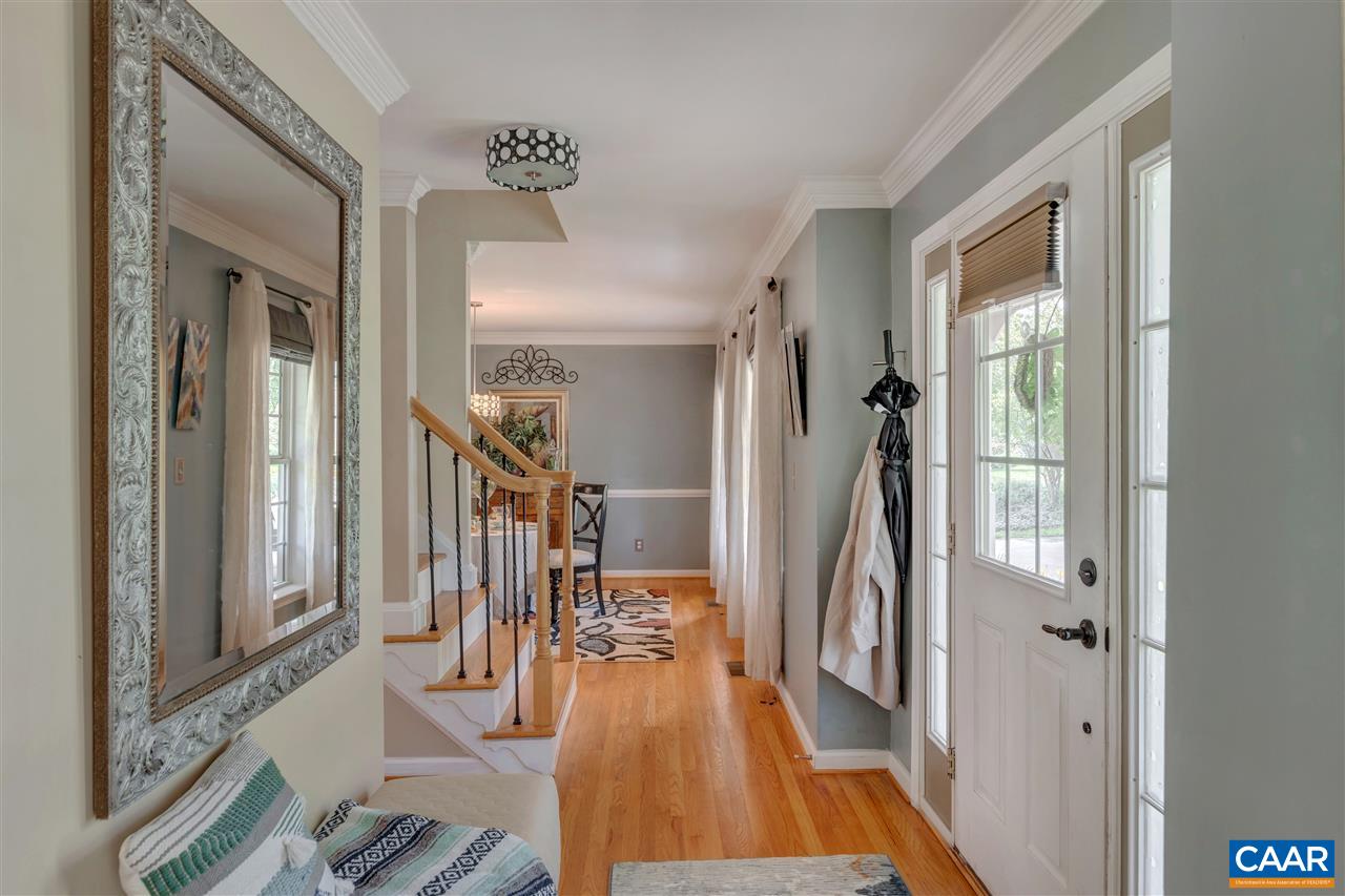 1209 Raintree Drive Charlottesville, VA 22901 - Photo 17 of 46 a view of a hallway with furniture and floor to ceiling window
