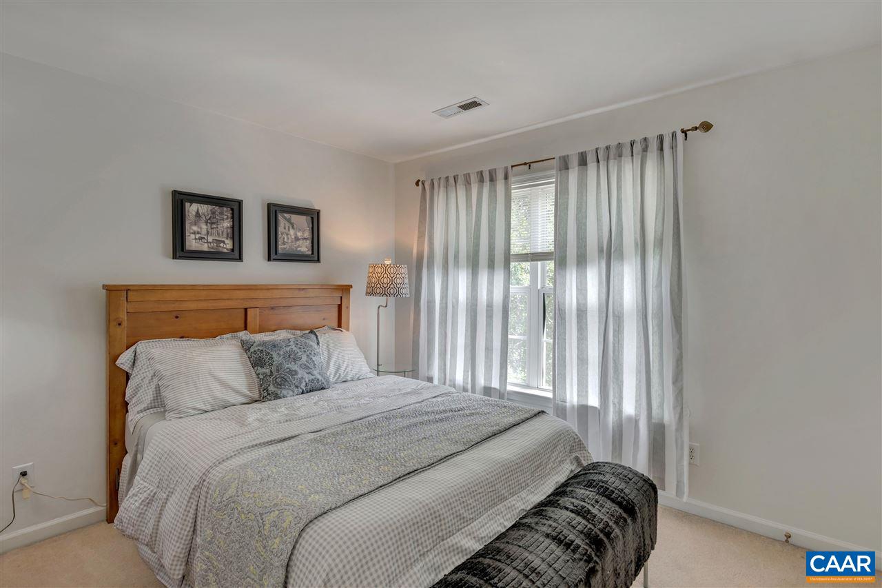 1209 Raintree Drive Charlottesville, VA 22901 - Photo 27 of 46 a bedroom with a bed and a window