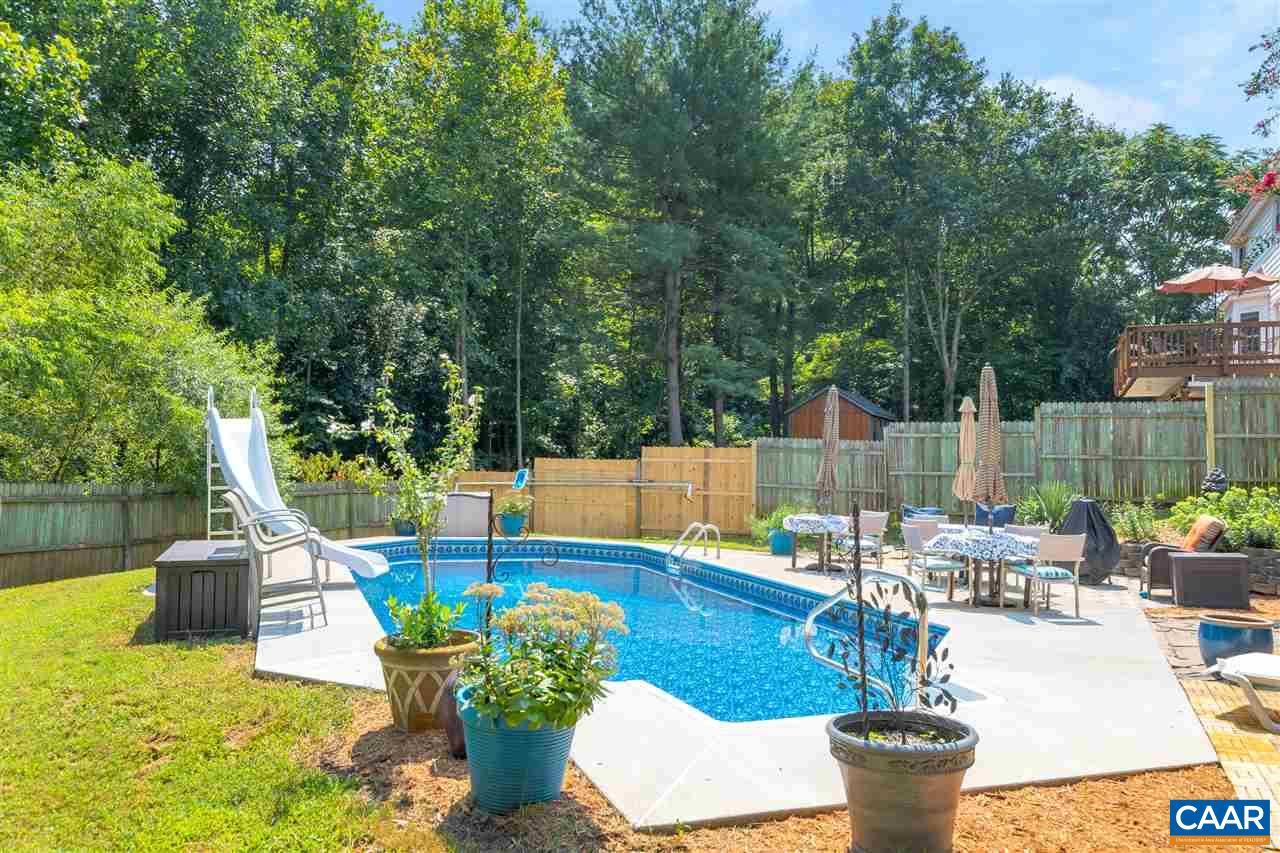 1209 Raintree Drive Charlottesville, VA 22901 - Photo 46 of 46 a view of a patio with couches chairs and a fire pit