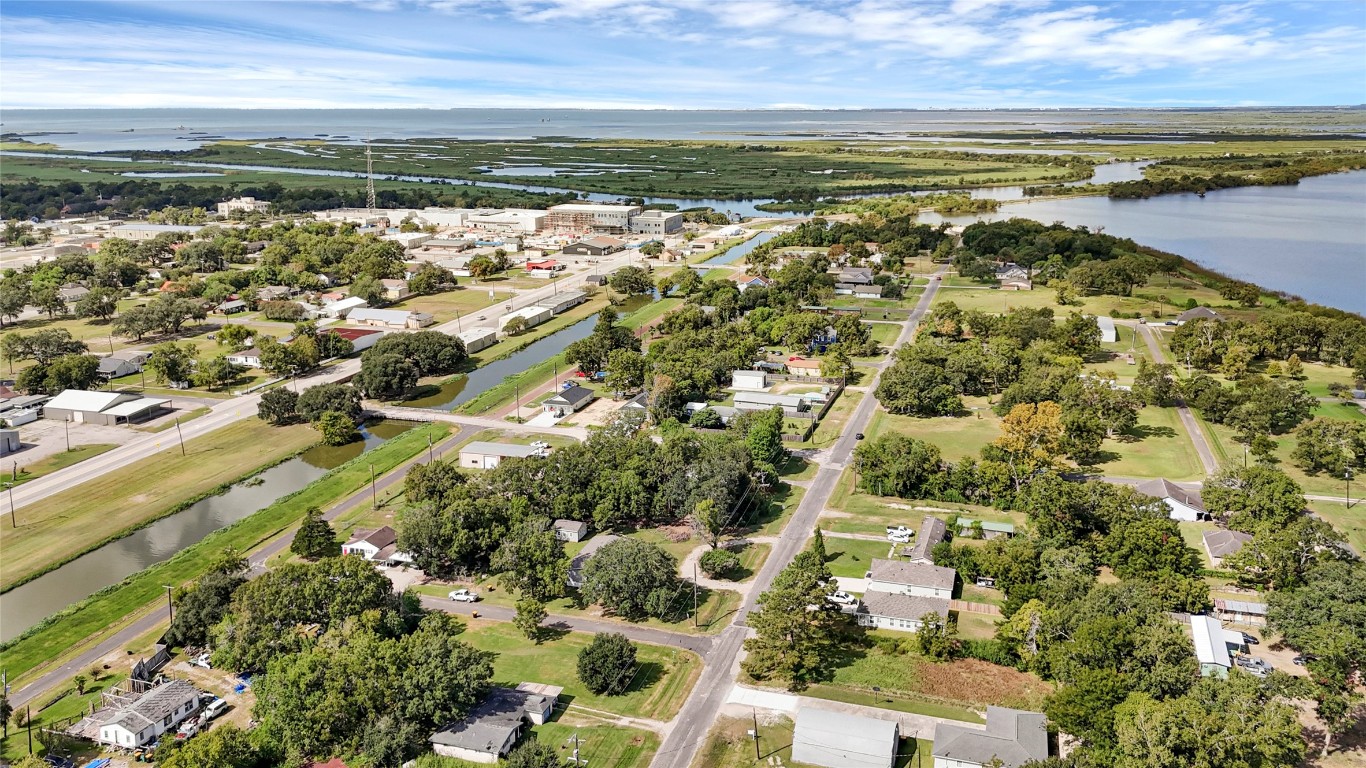 718 Main Street Anahuac, TX 77514 - Photo 16 of 26 an aerial view of residential building with ocean view