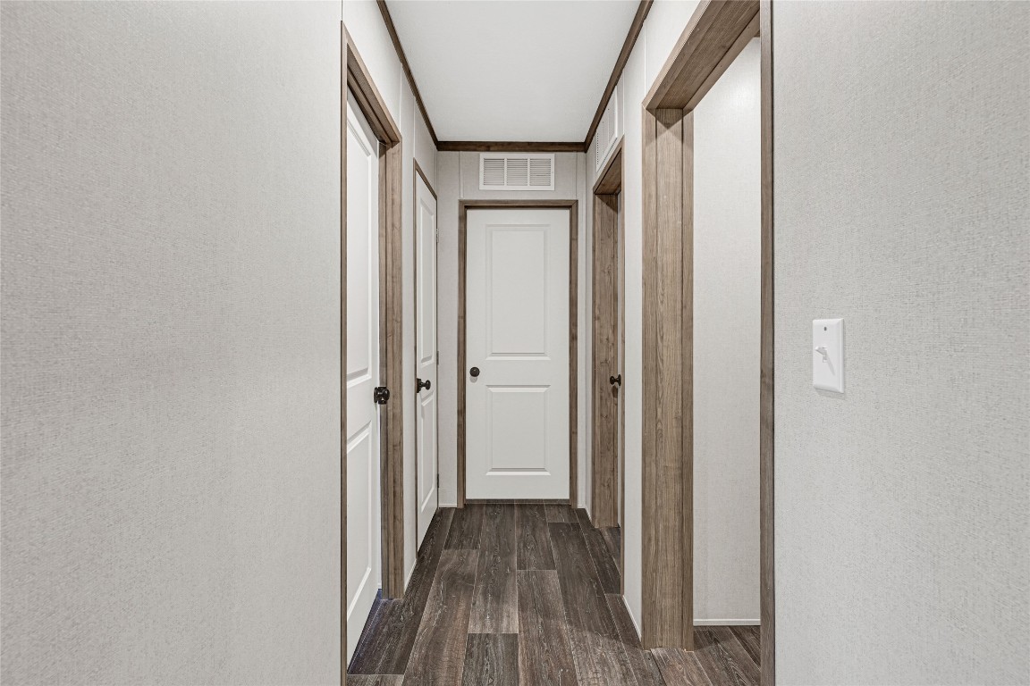 718 Main Street Anahuac, TX 77514 - Photo 17 of 26 a view of hallway with wooden floor