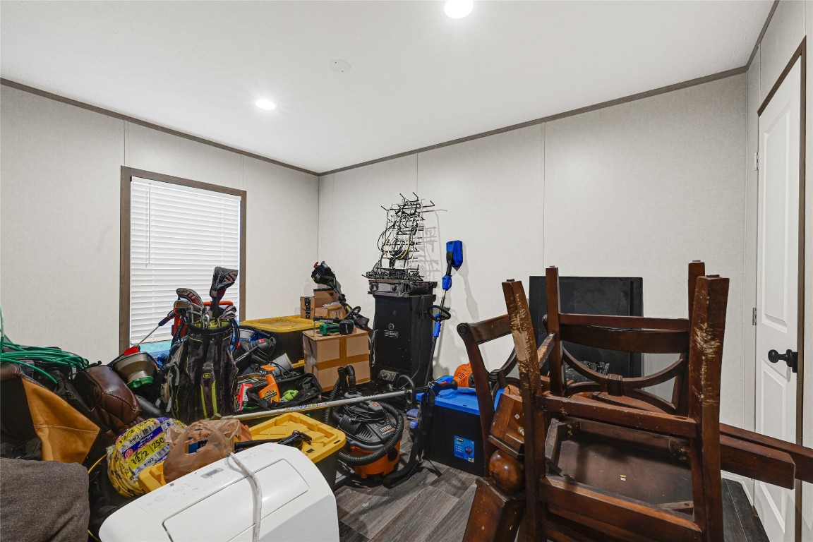 718 Main Street Anahuac, TX 77514 - Photo 21 of 26 a view of a room with gym equipment