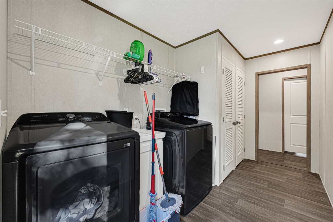 718 Main Street Anahuac, TX 77514 - Photo 22 of 26 a bedroom with a bed and a mirror