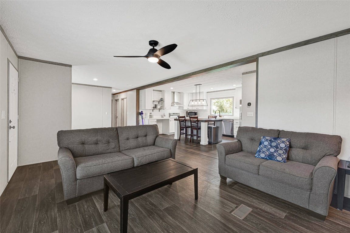 718 Main Street Anahuac, TX 77514 - Photo 5 of 26 a living room with furniture and view of kitchen