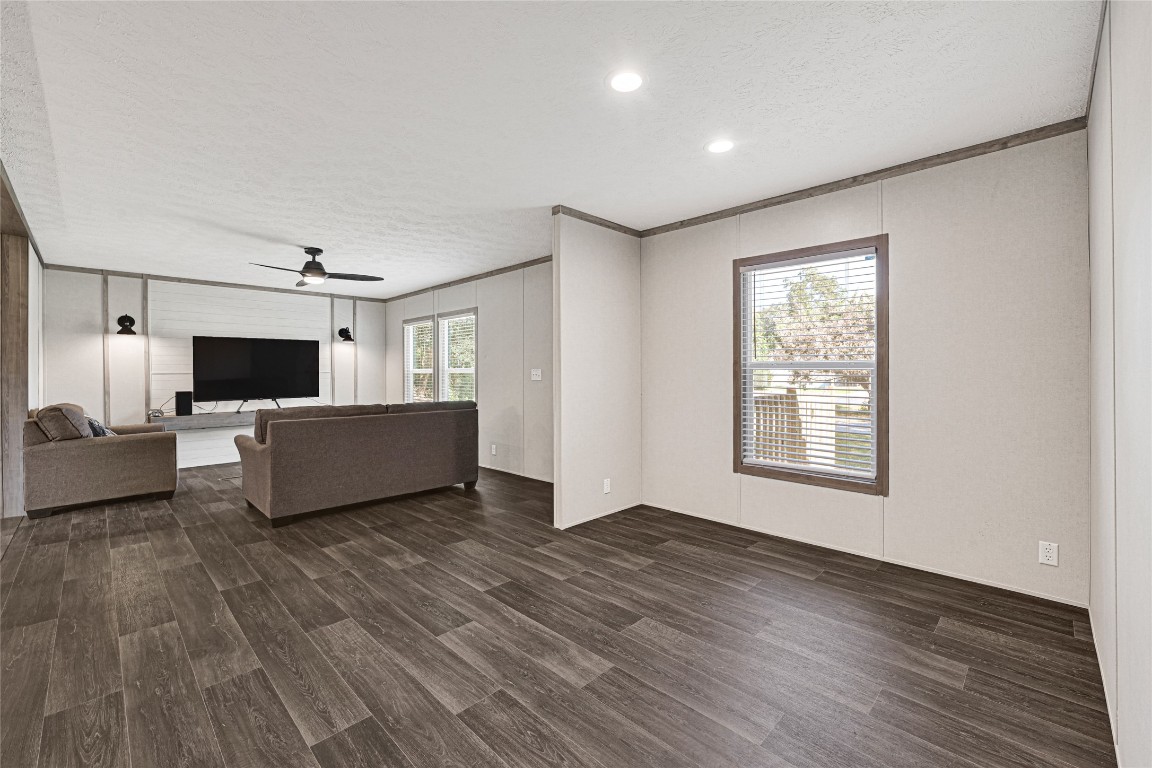 718 Main Street Anahuac, TX 77514 - Photo 8 of 26 a living room with furniture and a flat screen tv