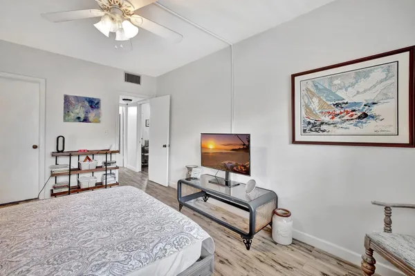 a bedroom with furniture and a bed