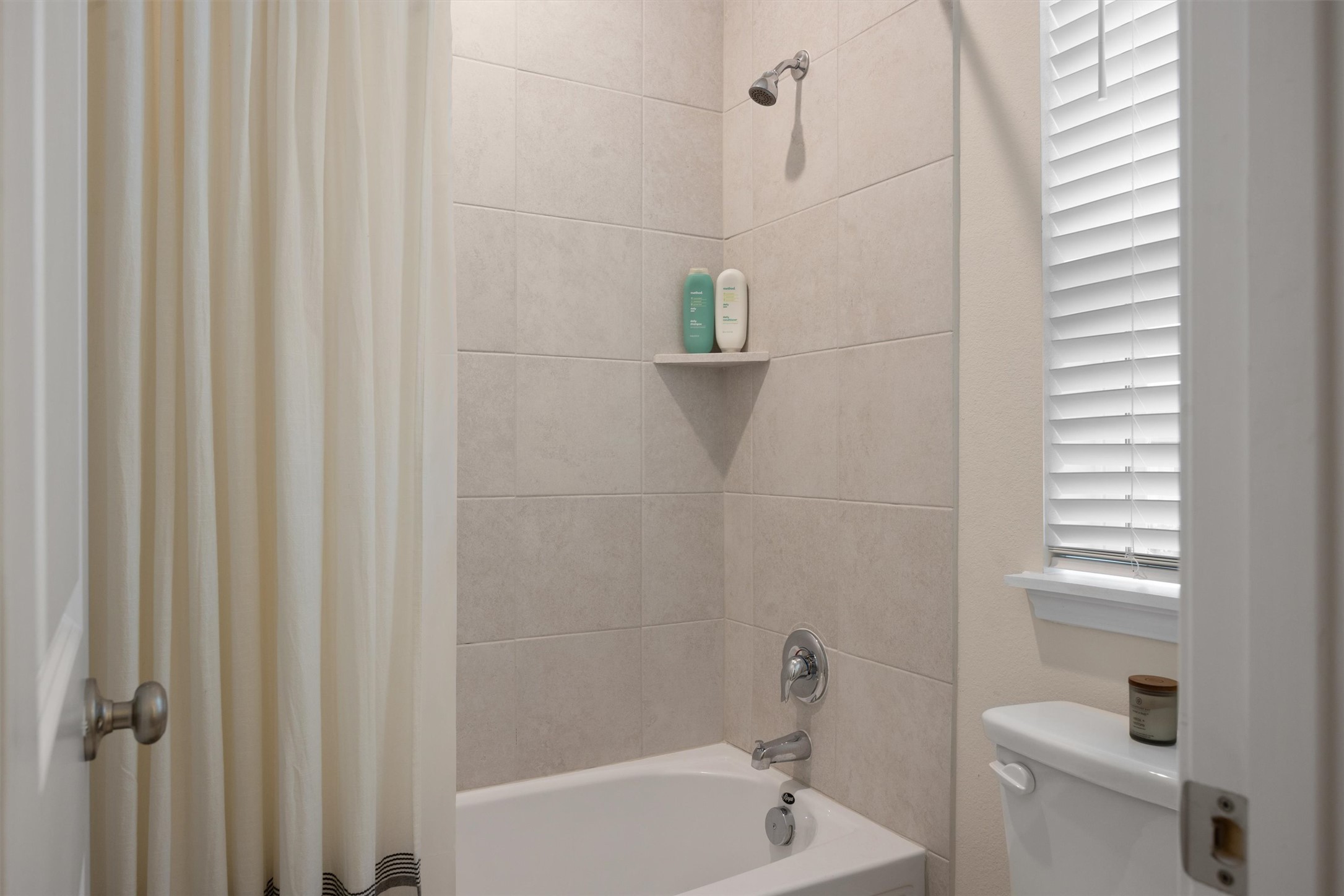 313 Toddy Way Leander, TX 78641 - Photo 29 of 39 Bathroom with shower / tub combo with curtain and toilet