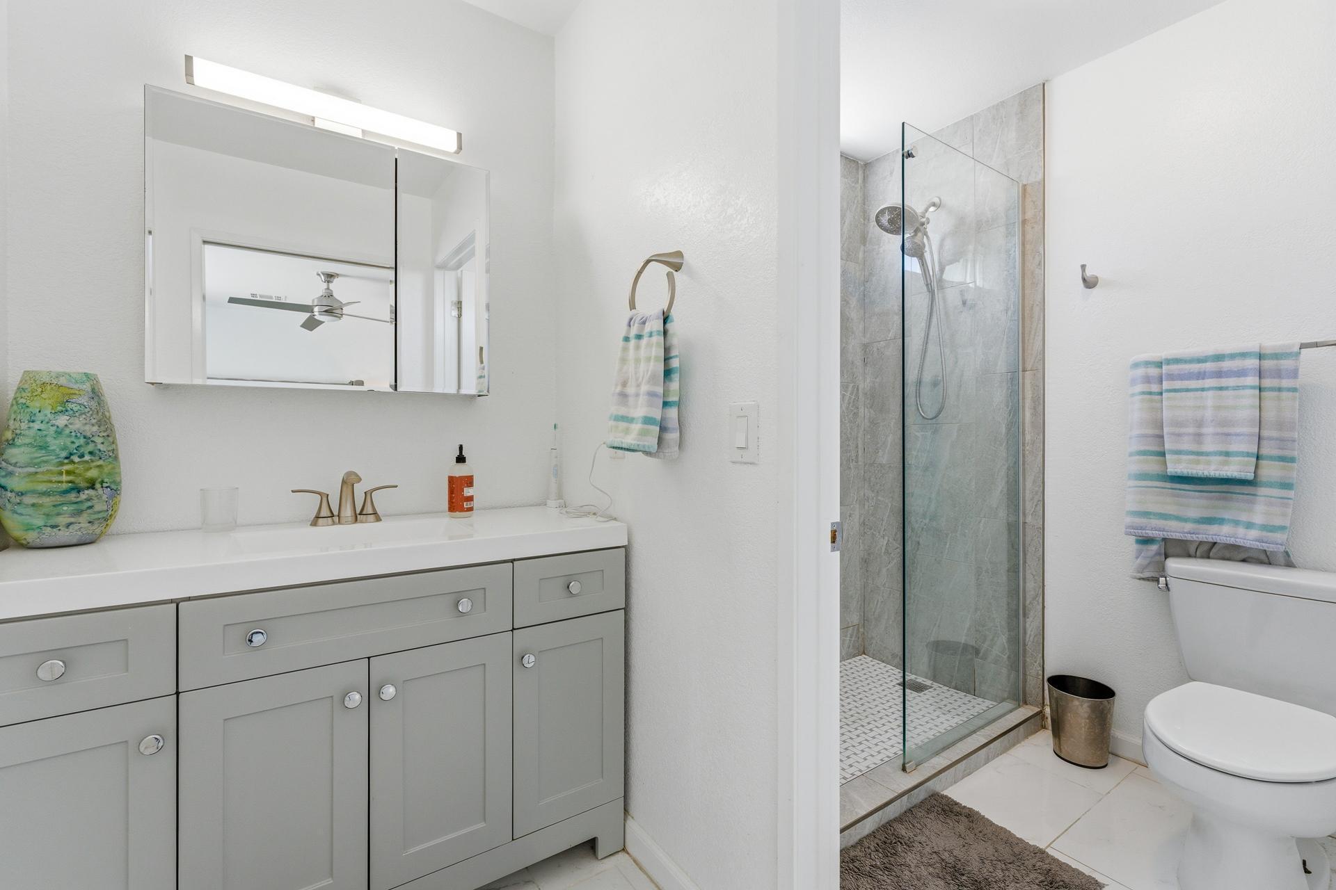 67220 Quijo Road Cathedral City, CA 92234 - Photo 19 of 26 a bathroom with a granite countertop sink toilet and shower